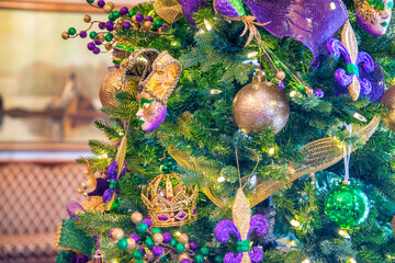 Christmas tree with New Orleans colors. Holiday and carnival concept. - obrazy, fototapety, plakaty