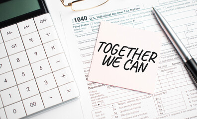 Together We Can with pen, calculator, glass and sticker. Tax report sign