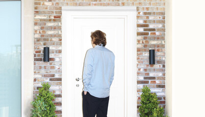 Man opening the door of her home.Inviting the guests