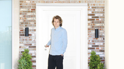 Man opening the door of her home.Inviting the guests