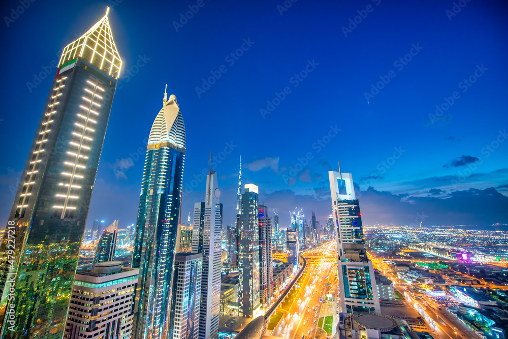 Poster Downtown Dubai skyscrapers along Sheikh Zayed road, aerial view at night.