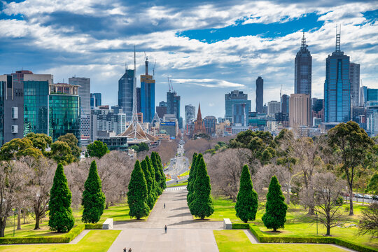 MELBOURNE, AUSTRALIA - SEPTEMBER 6, 2018: City skyline from Shrine of Remembrance park on a sunny day.