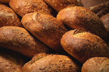 Lots of French bread rolls. Freshly baked French rolls are delicious. Close-up