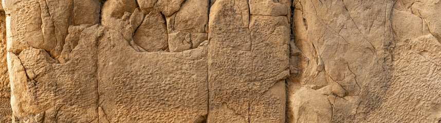 ancient wall texture of cracked stone blocks