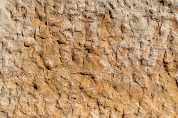 texture of a natural rough-cut stone of an ancient building
