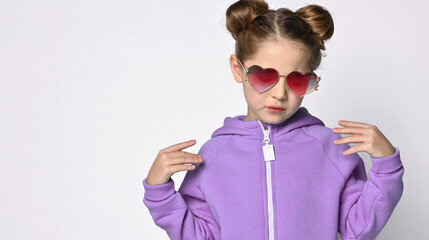 portrait of a fashionable girl in a purple hoodie and pink stylish glasses, says look at me how...