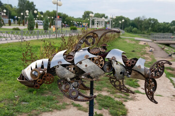 Iron performance. Art object Iron fish in steampan style. Installed on the embankment of the Seraya...