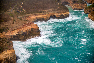 Aerial view of the Loch Ard Gorge area with limestone stacks from helicopter, Australia.