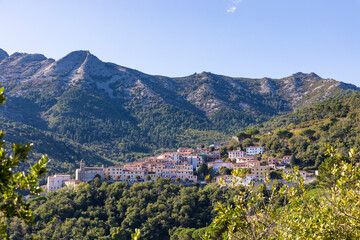 View of the village of Poggio in the mountains of the island of Elba in Italy under a bright blue sky in summer
