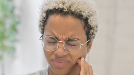 Close up of African Woman having Cavity, Toothache