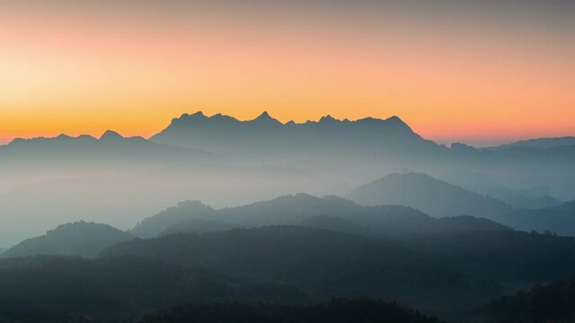 Sunrise over Doi Luang Chiang Dao mountain and foggy on hill in national park from Doi Kham Fah viewpoint at Chiang Dao