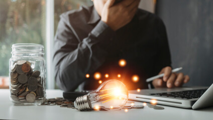 Businessman touching a bright light bulb. Concept of Ideas for presenting new ideas Great inspiration and innovation new beginning.