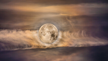 Moon and clouds photographed at different settings to have both show up 