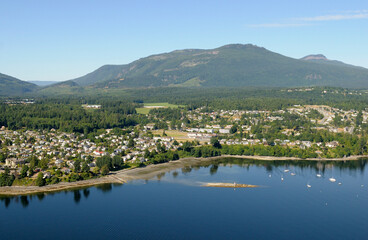 Aerial photo of Chemainus, the light on Bird Rock and the good boat anchorage in the town,...