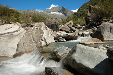 torrent meanders through the Averole valley towards the village of Bessans in Haute Maurienne in the French Alps