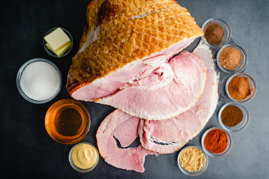 Ingredients for a Glazed Spiral Cut Ham: A smoked ham with honey, sugar, and spices to make a glaze