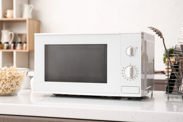 White microwave oven on counter in kitchen