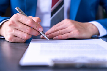 business man reading and signing a business contract, business agreement consensus signing, business concept and signing