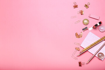notepad and stationery pencils, scotch tape, paper clips on pink background top view space for text 