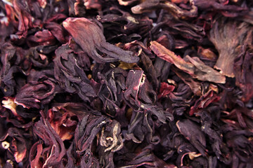 Hibiscus flower red tea karkade, dried petals of Sudanese rose texture background