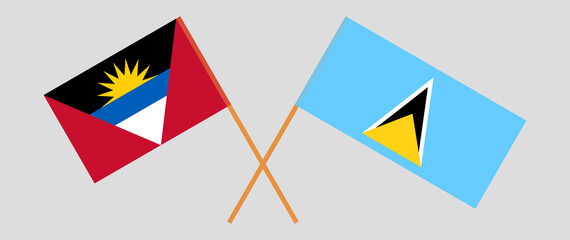 Crossed flags of Antigua and Barbuda and Saint Lucia. Official colors. Correct proportion