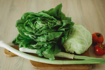 fresh green salad on a wooden table