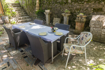 MOGORJELO, BOSNIA AND HERZEGOVINA - JUNE 9, 2019: Table in Villa Rustica restaurant near Mogorjelo, Bosnia and Herzegovina