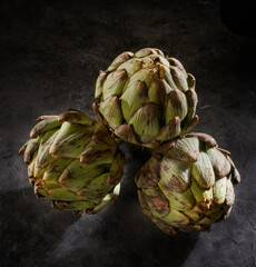 Fototapeta premium artichokes on a dark background