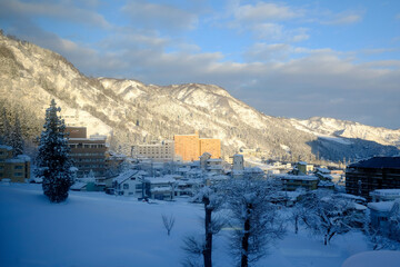 Fototapeta na wymiar Morning snowscape in Echigoyuzawa, Niigata, Japan, 2022/1/1