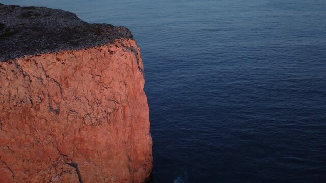 Romantic Nature Series. Aerial image of the cliffs of the town of Sagres, on a romantic sunset trip in Portugal with a view of the Atlantic Ocean, perfect for a weekend getaway .european continental 