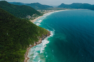 Fototapeta na wymiar Scenic coastline with mountains and Atlantic ocean with waves in Brasil. Aerial view