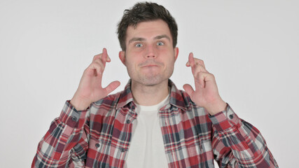 Portrait of Young Man Praying with Fingers Crossed