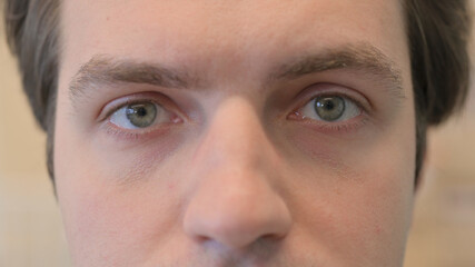 Close up of Blinking Eyes of Young Man