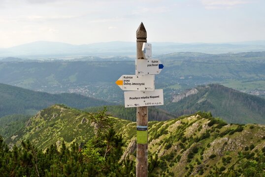 Signpost On The Mountain Trail. Polish Mountains. The Direction Of Travel.