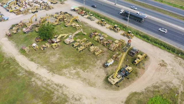 Aerial top view of new truck tractor cars parking for sale stock lot row, dealer inventory import and export business commercial, Automobile and automotive industry distribution logistic transport