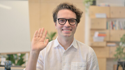 Portrait of Young Man Waving, Welcoming