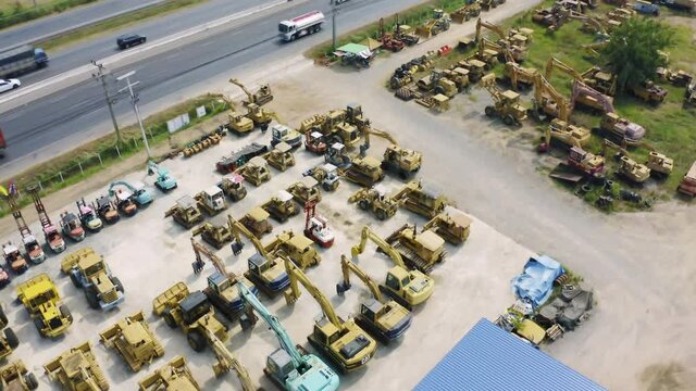 Aerial top view of new truck tractor cars parking for sale stock lot row, dealer inventory import and export business commercial, Automobile and automotive industry distribution logistic transport