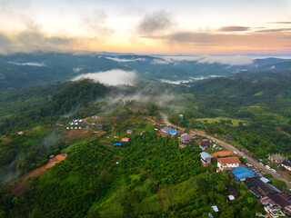 Fototapeta na wymiar Top view Aerial photo from flying drone over Mountain and Mist in Pha Chang noi Phayao Province Thailand,ASIA.