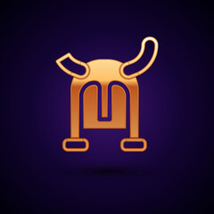 Gold Viking in horned helmet icon isolated on black background. Vector