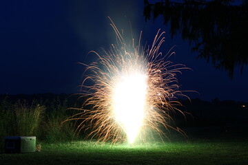 sparkler on ground at night