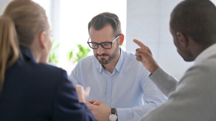 Young Business People Scolding Colleague