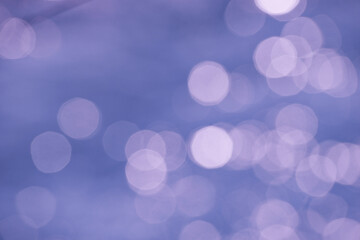 Beautiful festive background from the bokeh effect from glare in the form of circles in the color...