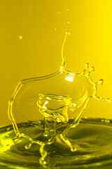 splash photography with yellow liquid