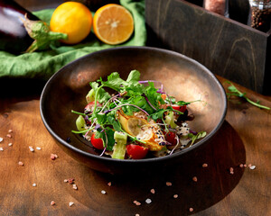 Avocado salad on a wooden background