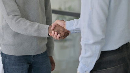 Close up of Handshake between Mixed Race Businessmen