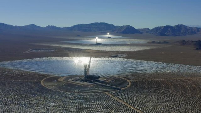 Aerial view of solar electric generating system in Nevada, USA - circling, drone shot