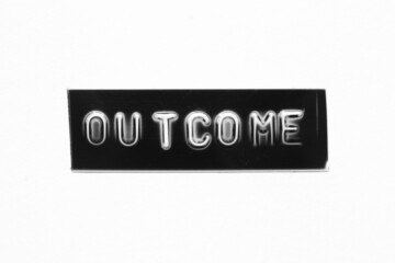 Black color banner that have embossed letter with word outcome on white paper background