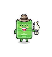 Naklejka premium football field zookeeper mascot with a parrot