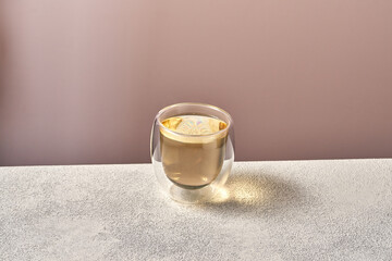 White tea in a transparent glass on a white background