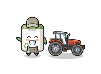 the trash can farmer mascot standing beside a tractor